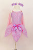 Pink  leotard with lavender  lace overlay & pink  rose accents has pale pink chiffon back draping & lace petal overlay on tulle layers with large front bow. Comes with 2 matching hair combs. Front