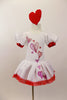 White velvet leotard dress has pouf sleeves with red cuffs. hand painted glittery hearts cascade down the bodice and skirt . There is a red tulle petticoat and the skirt is edged with red lace Comes with heart hair accessory. Front