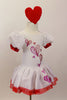 White velvet leotard dress has pouf sleeves with red cuffs. hand painted glittery hearts cascade down the bodice and skirt . There is a red tulle petticoat and the skirt is edged with red lace Comes with heart hair accessory. Side