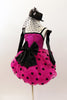 Hot pink sequined bodice has pink-black polk-a-dot bubble skirt with black satin front bow. Comes with black satin gauntlets and glittery black veiled top-hat. Left side