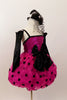 Hot pink sequined bodice has pink-black polk-a-dot bubble skirt with black satin front bow. Comes with black satin gauntlets and glittery black veiled top-hat. Right side