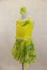 Soft yellow velvet leotard had  ruffled trim along bust,& waist. Skirt & back wing scarf is marbled yellow-green chiffon. Comes with matching hair accessory. Lef side