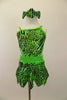 Lime green caveman print leotard dress has open sides, back & jagged skirt, Has pink glitter accents & crystals. Comes with wrist and leg scrunchies & hair bows. Front