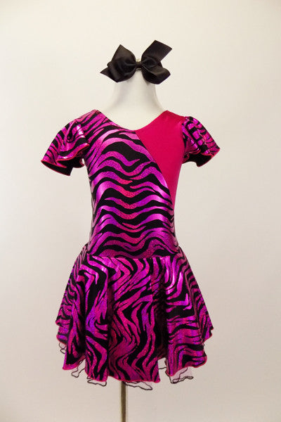 Hot pink metallic and zebra pattern, cross front leotard dress has zebra print ruffled cap sleeves and skirt with solid pink back.  Comes with black bow hair accessory. Front