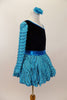 Black velvet leotard has single sleeve of soft, layered turquoise ruffles. Comes with matching turquoise ruffled skirt with petticoat and floral hair accessory. Right side