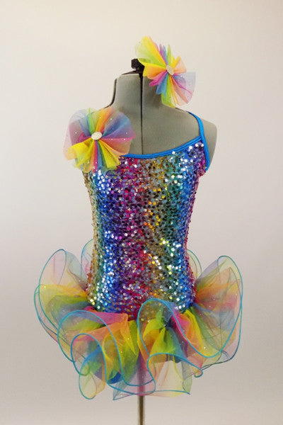 Rainbow colored square-sequined camisole leotard has attached rainbow colored, curly organza ruffle skirt. Comes with matching rainbow hair accessory.  Front