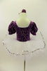 Purple velvet leotard has pouf sleeves & silver pattern. Neck-line is square cut with silver edging & large silver front bow. Comes with white pull-on tutu & floral hair accessory. Back