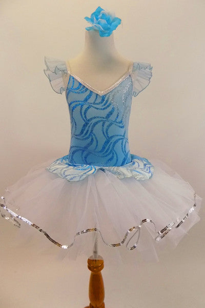 Pale Blue velvet leotard has glittery wave pattern and peplum that rests overtop of white tulle, romantic tutu skirt. Comes with floral hair accessory. Front