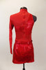 Bright red one sleeved mesh upper has cross-over alligator texture on bodice & skirt (shorts below). Has red crystals, matching belt and rose hair accessory. Back