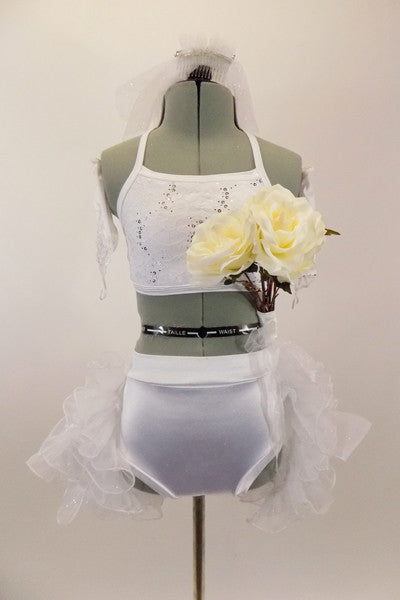 White half top is accompanied by a white satin briefs with open-front satin skirt edged with organza curly ruffle. Comes with  lacy gauntlets, veil & bouquet. Front