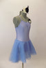 Pale blue leotard dress with floral accent has low back with looping cross strap design at lower back. The attached skirt is sheer layers of pale blue. Comes with hair accessory. Right Side
