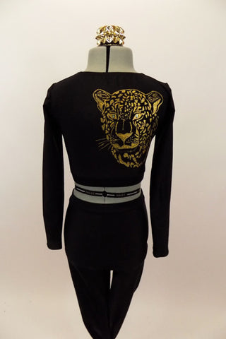 Long sleeved black crop top has large gold leopard/tiger with Swarovski eyes on right back shoulder. Accompanied by matching black leggings. Has gold hair piece. Back