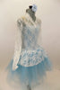 Pale blue leotard with romantic tutu of layered pale blue tulle, sits below a long sleeved ivory  V-neck lace dress with peplum. Comes with matching hair piece. Right side