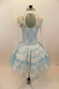 Pale blue leotard with romantic tutu of layered pale blue tulle, sits below a long sleeved ivory  V-neck lace dress with peplum. Comes with matching hair piece. Back