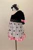 Dress has black velvet bodice with pouf sleeves, pink satin trim & bows. Skirt is white mesh with black dots & pink satin trim. Has dotted waist sash & hair bow. Left side