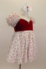 Dress has red velvet sweetheart bodice with open back and small crystal heart accent. The pouf sleeves and skirt are flowy white mesh with small red hearts. Comes with bow hair accessory. Right side