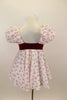 Dress has red velvet sweetheart bodice with open back and small crystal heart accent. The pouf sleeves and skirt are flowy white mesh with small red hearts. Comes with bow hair accessory. Back
