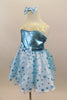 Glittering A-line dress has sparkle turquoise bodice with clear straps & wide ivory lace ruffle. Has blue polk-a-dot bottom with petticoat, gloves & hair piece. Left side