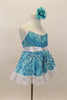 Camisole leotard dress has swirls  of blues on aqua base. Has a white petticoat and wide lace trim. White satin waist sash had a crystal heart. Has floral hair accessory. Side