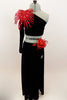 Black velvet 2-piece costume has one long sleeve & shoulder half top with large red floral leaf accessory at  shoulder. The long skirt has full length slit. Comes with red floral hair accessory. Front