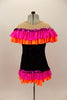 Black tunic style leotard dress has nude drop shoulder with orange & hot pink ruffles. The bottom has matching ruffled edge that comes up in the front. Comes with hair accessory. Back
