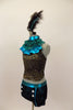 Black & gold lace halter has separate ruffled high neck turquoise collar. Lace shorts have turquoise piping & button accents. Has large feather hair accessory. Left side