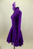 Purple lace high neck, long sleeved open back dress has large jeweled crystal attached necklace. Comes with large matching purple hair accessory. Left side