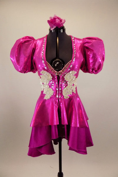 Pink iridescent pouf sleeved peplum tailcoat had crystal accents & large white beaded appliques.Beneath is pink crystaled bra and patterned fuchsia briefs. Front