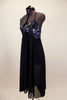 Navy blue chiffon empire waist dress has sequined/beaded lace bust with large center brooch. Low back has thin cross straps. Comes with matching hair accessory. Left side