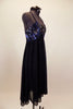 Navy blue chiffon empire waist dress has sequined/beaded lace bust with large center brooch. Low back has thin cross straps. Comes with matching hair accessory. Right side