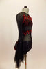 Black long sleeved sheer leotard has front bust panel in flame pattern edged in red sequins. Black shorts have flame pattern repeated on back with sheer bustle. Fight side