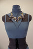 Blue-grey costume has camisole top with corset back & attached high neck collar with large jeweled necklace. Has matching long skirt with side slits & hair clip. Front zoomed