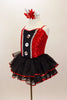 Red sparkle sequin bodice has black satin insert  with sequined-crystal buttons, silver cording & crystalled straps. Has attached sequined ruffle skirt. Left side