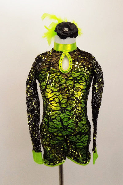 Black sequin stretch lace covers lime biketard with front peep-hole & key-hole back. Has long sleeve lace sleeves with metallic lime cuffs and hair accessory. Front
