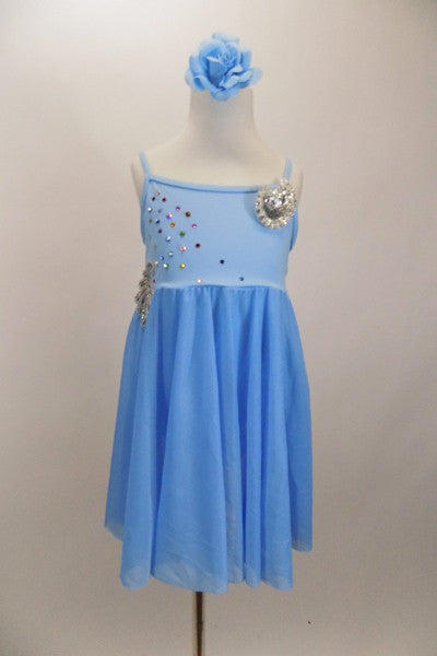 Soft baby blue camisole leotard dress has empire waist with soft blue sheer skirt. Bodice has crystal accents & sequin detail . Comes with hair accessory. Front