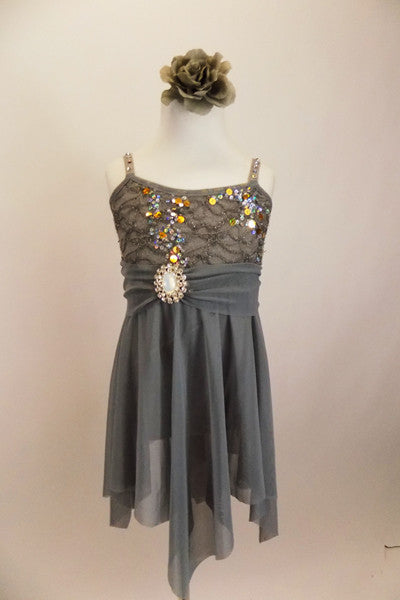  Empire waist lyrical dress has jagged mesh skirt & silver sequined lace bust. Has crystaled straps & sash with large crystal-opal brooch & matching hair piece. Front