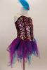 The hologram sequin-spandex bodice has large sequined applique at hip. Has attached teal-magenta, tattered glitter skirt & turquoise feather hair accessory. Right side