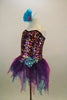 The hologram sequin-spandex bodice has large sequined applique at hip. Has attached teal-magenta, tattered glitter skirt & turquoise feather hair accessory. Left side