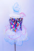 White leotard dress has brightly coloured square sequin chips on bodice & crystal accents. Skirt has three layers of colour edged curly ruffle and matching hair accessory. Front