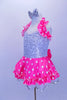 Silver sequined leotard dress has attached skirt with bright pink satin polka dot overlay on white ruffled tricot. Has bow at the back, halter ruffle & hair bow. Left side