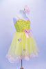 Yellow tutu dress has sequin bodice with satin bow & rose at front. Skirt is layers of yellow tricot with  pale pink satin rosettes. Has matching hair accessory. Right side