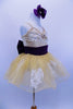 White lace appliqués adorn the champagne stretch-satin camisole bodice & attached gold sparkle tutu skirt. Has wide eggplant cummerbund with large back bow. Has matching hair accessory. Right side