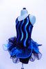 Blue sequin wave pattern covers the bodice of camisole biketard. Three-tiered glitter tulle skirt has a black & blue curly hem. Comes with top hat & gloves. Left side