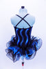 Blue sequin wave pattern covers the bodice of camisole biketard. Three-tiered glitter tulle skirt has a black & blue curly hem. Comes with top hat & gloves. Back