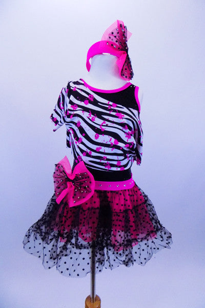 Tank biketard has sparkling black bodice with cerise binding. Attached skirt is black lace & cerise petticoat. Comes with zebra splatter print top & headband. Front