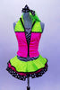 Sequined zebra-print  biketard has separate pink & lime zippered vest. The attached cerise pink & lime layered ruffle skirt has polka dot ribbon accent. Comes with matching hair accessory. Front