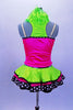 Sequined zebra-print  biketard has separate pink & lime zippered vest. The attached cerise pink & lime layered ruffle skirt has polka dot ribbon accent. Comes with matching hair accessory. Back