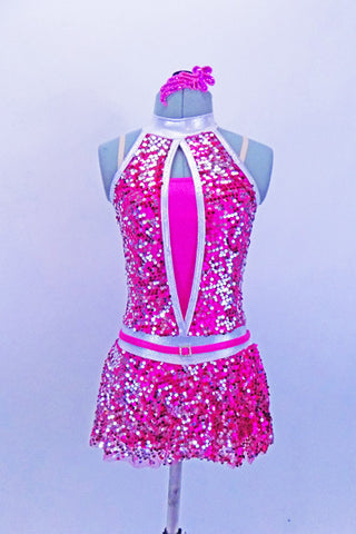 Fuchsia metallic biketard base has silver halter collar & attached, silver-fuchsia fully sequined peek-a-boo bodice & skirt. Has matching hair accessory & belt. Front