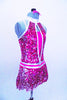 Fuchsia metallic biketard base has silver halter collar & attached, silver-fuchsia fully sequined peek-a-boo bodice & skirt. Has matching hair accessory & belt. Right side