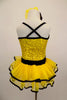 Yellow sequin leotard has black velvet accents with crystals. Black satin rosettes accent the waist & hair accessory. Has ruffle layer skirt with black trim. Back